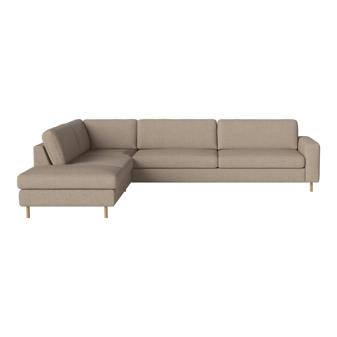 Light beige sectional sofa with a simple, clean design and wooden legs, perfect for modern living spaces.