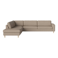 Light beige sectional sofa with a simple, clean design and wooden legs, perfect for modern living spaces.