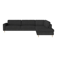 Dark gray sectional sofa with clean lines and wooden legs, offering a modern and minimalist design.