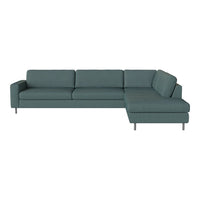 Teal sectional sofa with clean lines and a textured fabric pattern, perfect for modern living spaces.