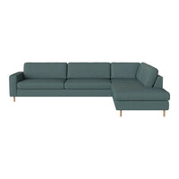 Teal sectional sofa with a smooth fabric texture and elegant wooden legs, perfect for modern living spaces.