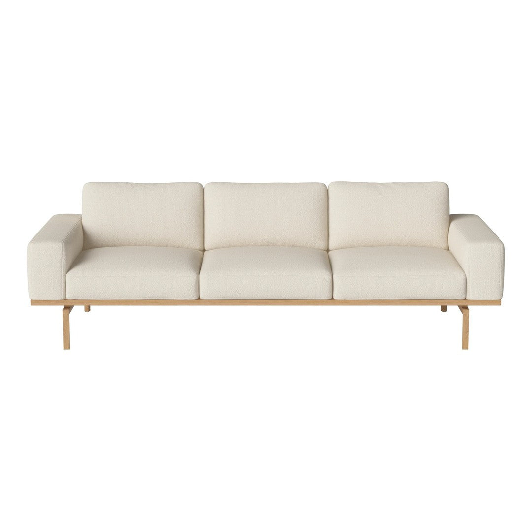 Neutral cream sofa with clean lines and a natural wood base, perfect for modern minimalist decor.