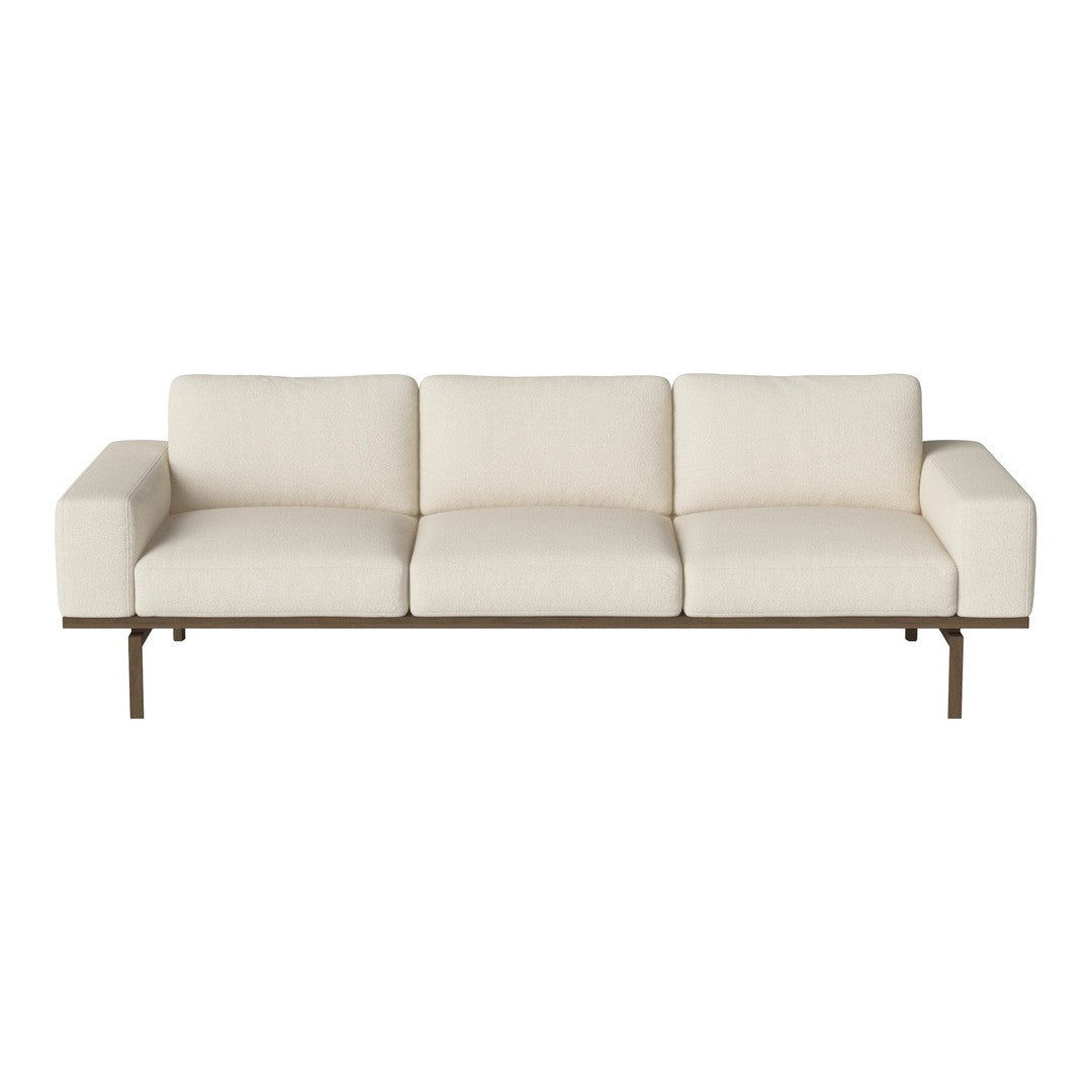 Stylish beige sofa with smooth upholstery and a minimalist design, featuring a sleek metal frame.