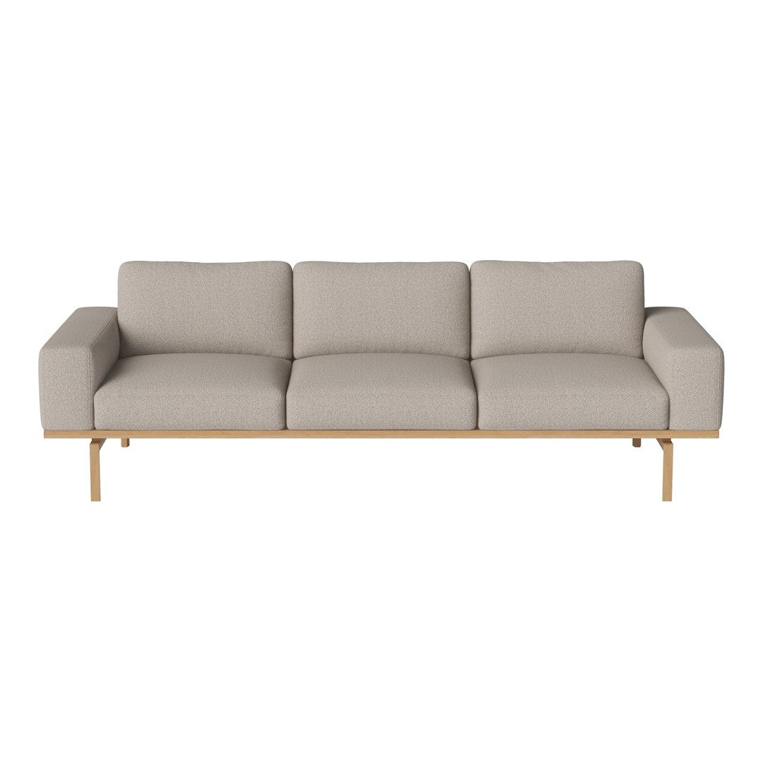 Light gray three-seater sofa with a minimalist design and wooden legs, featuring smooth, textured upholstery.