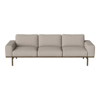 Light beige sofa with a minimalist design and smooth fabric upholstery, complemented by a sleek wooden frame.