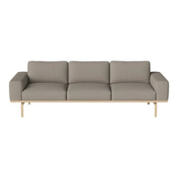 Modern three-seater sofa in soft light gray fabric with a minimalist wooden frame.