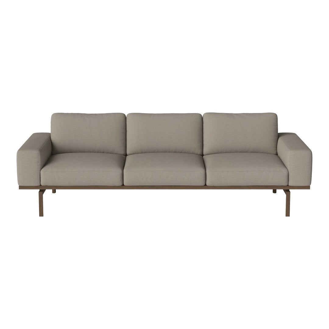 Light gray sofa with smooth upholstery and minimalistic pattern, featuring straight lines and a modern design.