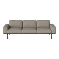 Light gray sofa with smooth upholstery and minimalistic pattern, featuring straight lines and a modern design.