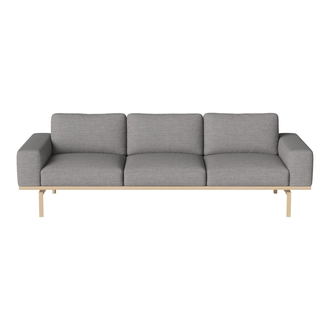 Gray upholstered sofa with clean lines and a sleek wooden base, perfect for modern decor.