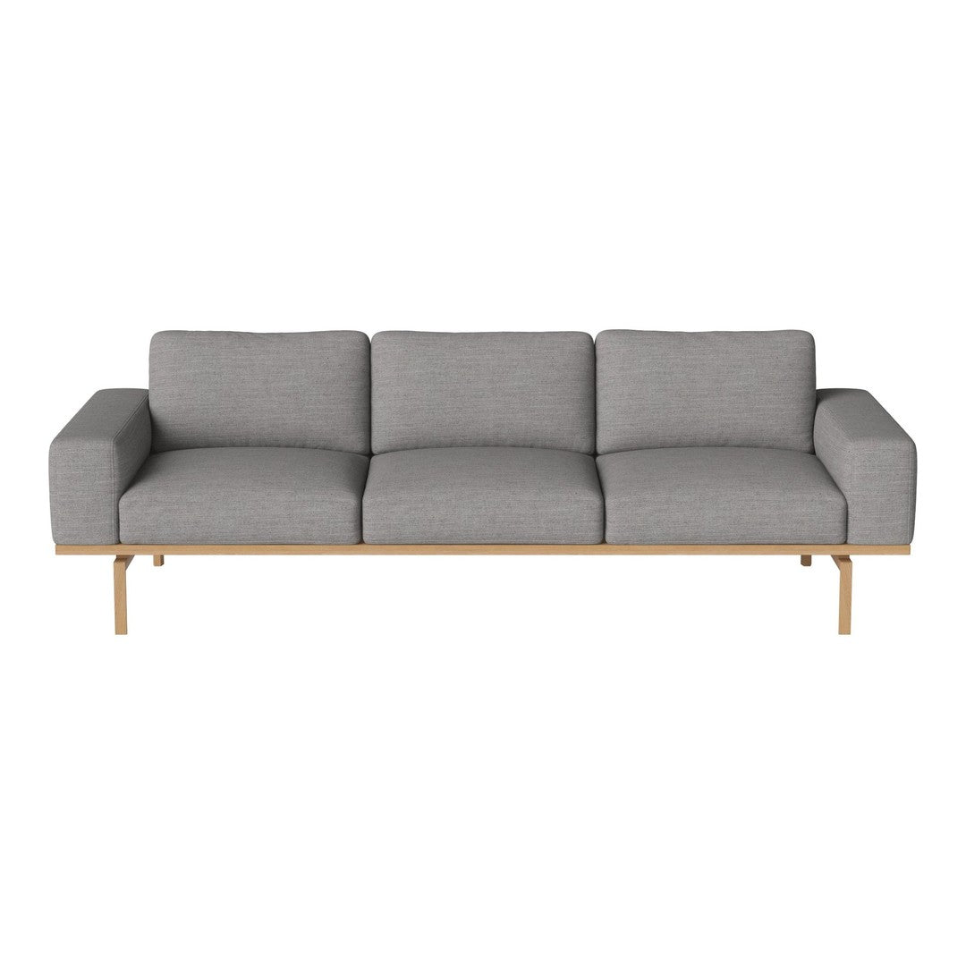 Gray upholstered sofa with a sleek, minimalistic design and light wood legs. Perfect for modern interiors.