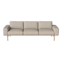 Light beige three-seater sofa with a smooth, textured fabric and wooden legs, perfect for modern living rooms.