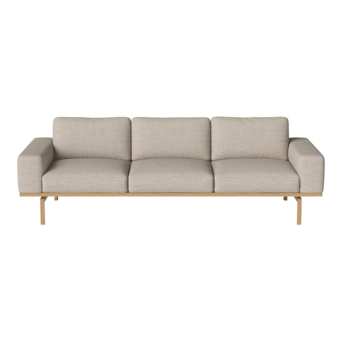 Light beige three-seater sofa with a smooth, textured fabric and wooden legs, perfect for modern living rooms.