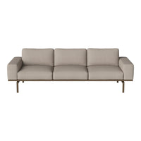 Beige fabric sofa with clean lines and minimalist design, featuring a sleek metal frame. Perfect for modern decor.