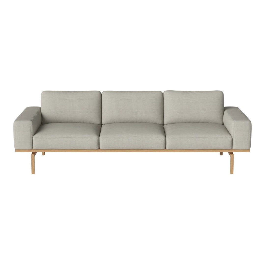 Light grey upholstered sofa with clean lines and natural wood legs, ideal for modern minimalist decor.