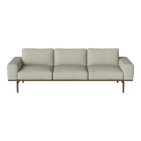Light gray textured sofa with simple modern design and clean lines, featuring a sleek metal frame.