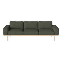 Sleek modern sofa in deep green fabric with a light wood base, featuring a minimalist design and clean lines.