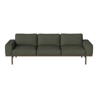 Modern dark green fabric sofa with sleek, minimalist design and sturdy metal legs. Perfect for contemporary interiors.