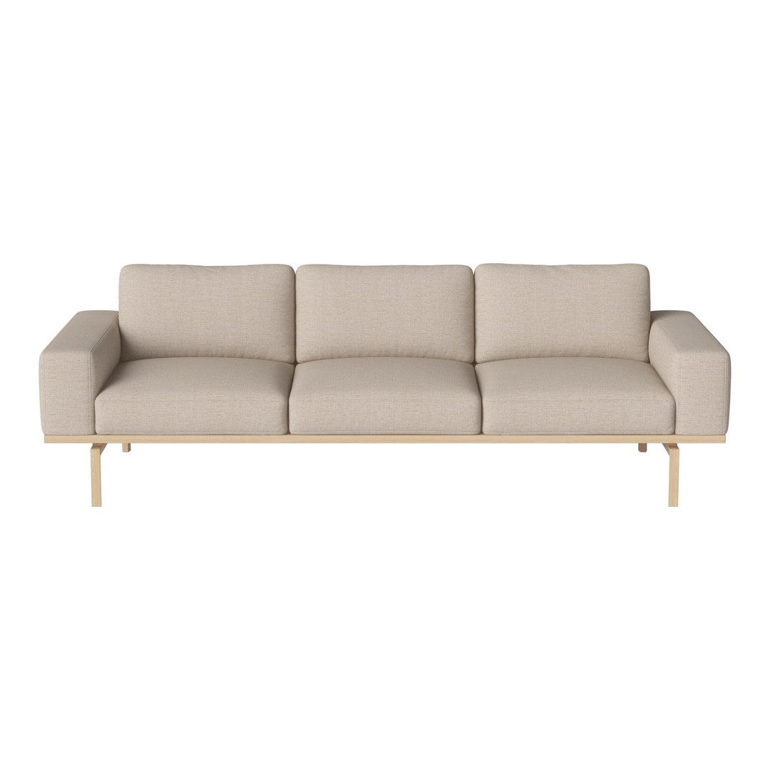 Beige three-seater sofa with a minimalist design and smooth fabric upholstery, complemented by a sleek wooden frame.
