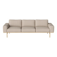 Beige three-seater sofa with a minimalist design and smooth fabric upholstery, complemented by a sleek wooden frame.