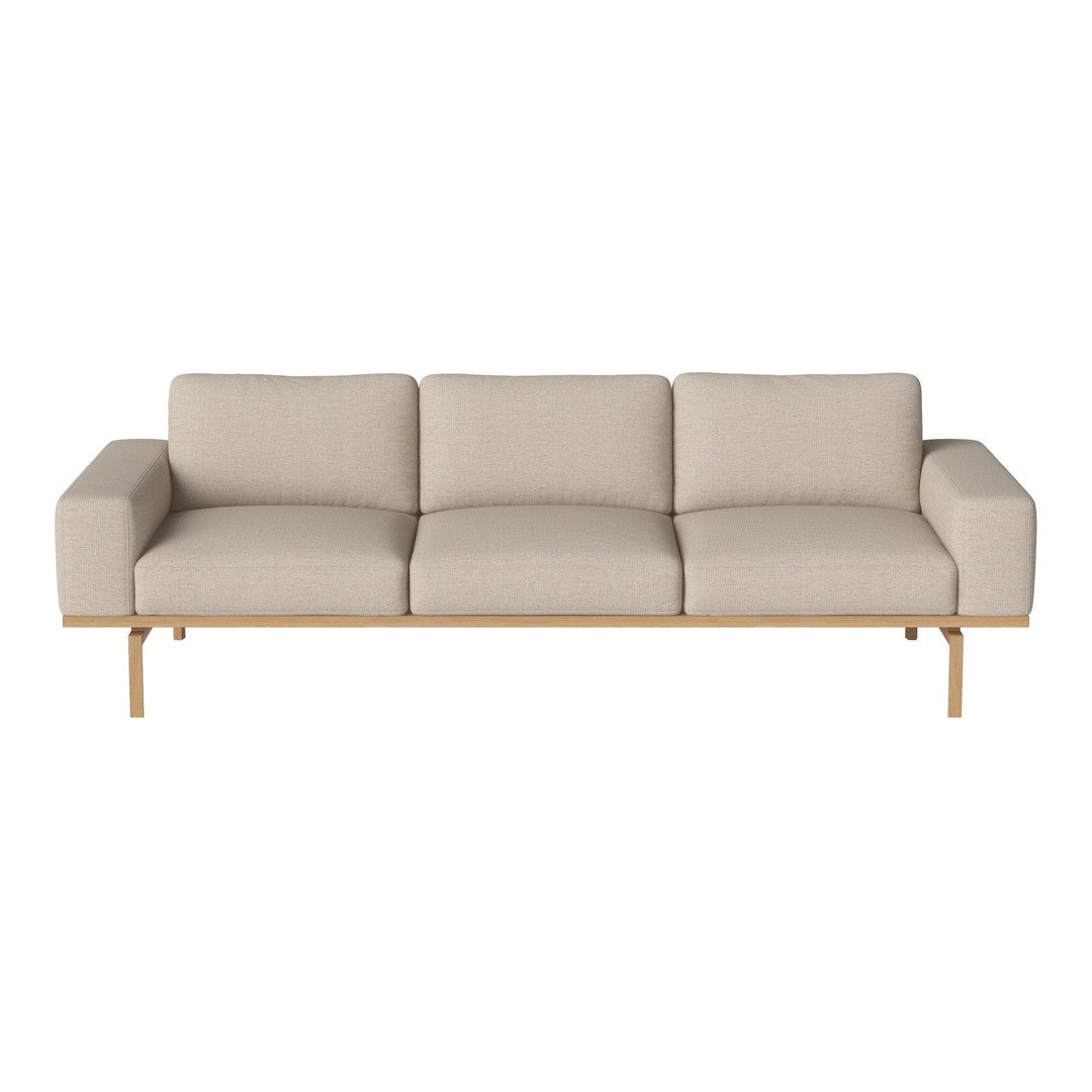 Beige upholstered sofa with a sleek wood base, featuring minimalistic design and soft, textured fabric.