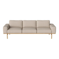 Beige upholstered sofa with a sleek wood base, featuring minimalistic design and soft, textured fabric.
