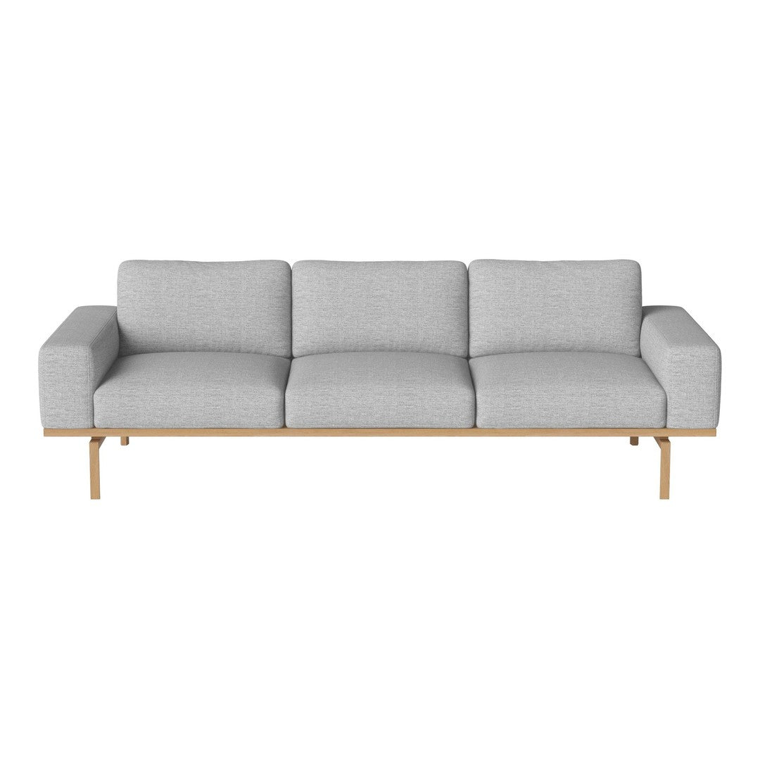 Gray upholstered sofa with clean lines and a natural wood base, offering a modern and minimalist aesthetic.