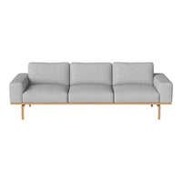 Gray upholstered sofa with clean lines and a natural wood base, offering a modern and minimalist aesthetic.