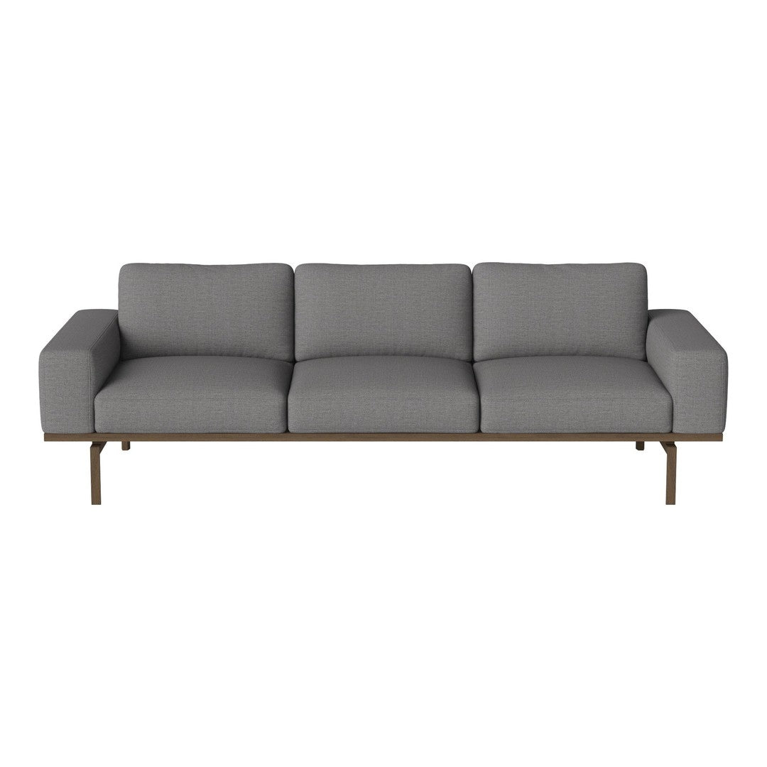Gray upholstered sofa with a sleek design and subtle textured pattern, featuring a minimalist brown metal frame.