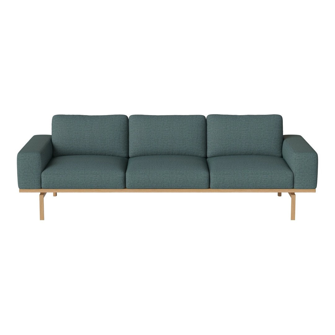 Teal modern sofa with textured fabric and wooden base, perfect for contemporary living spaces.