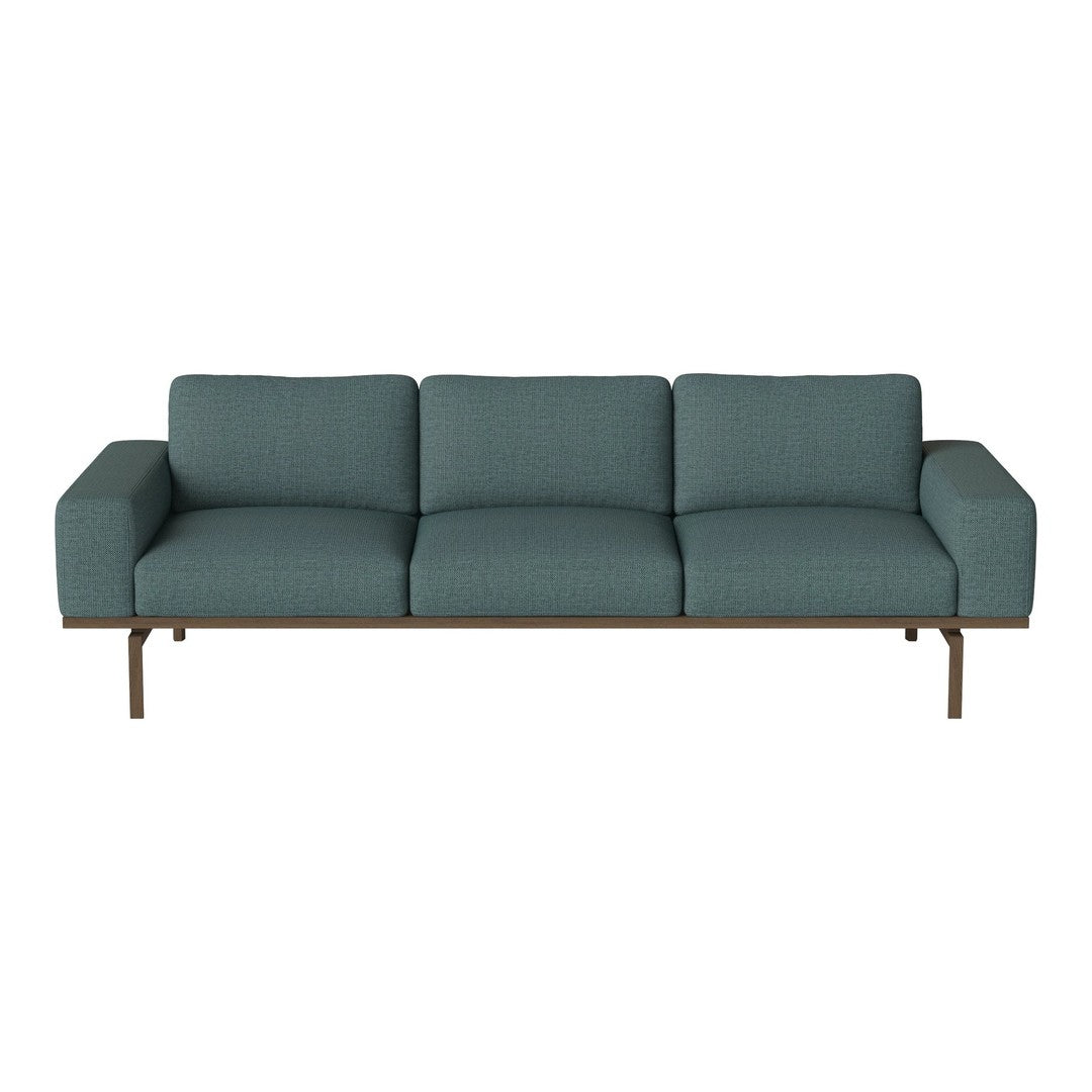 Teal upholstered sofa with a geometric pattern and sleek wooden frame, adding a modern touch to any living space.