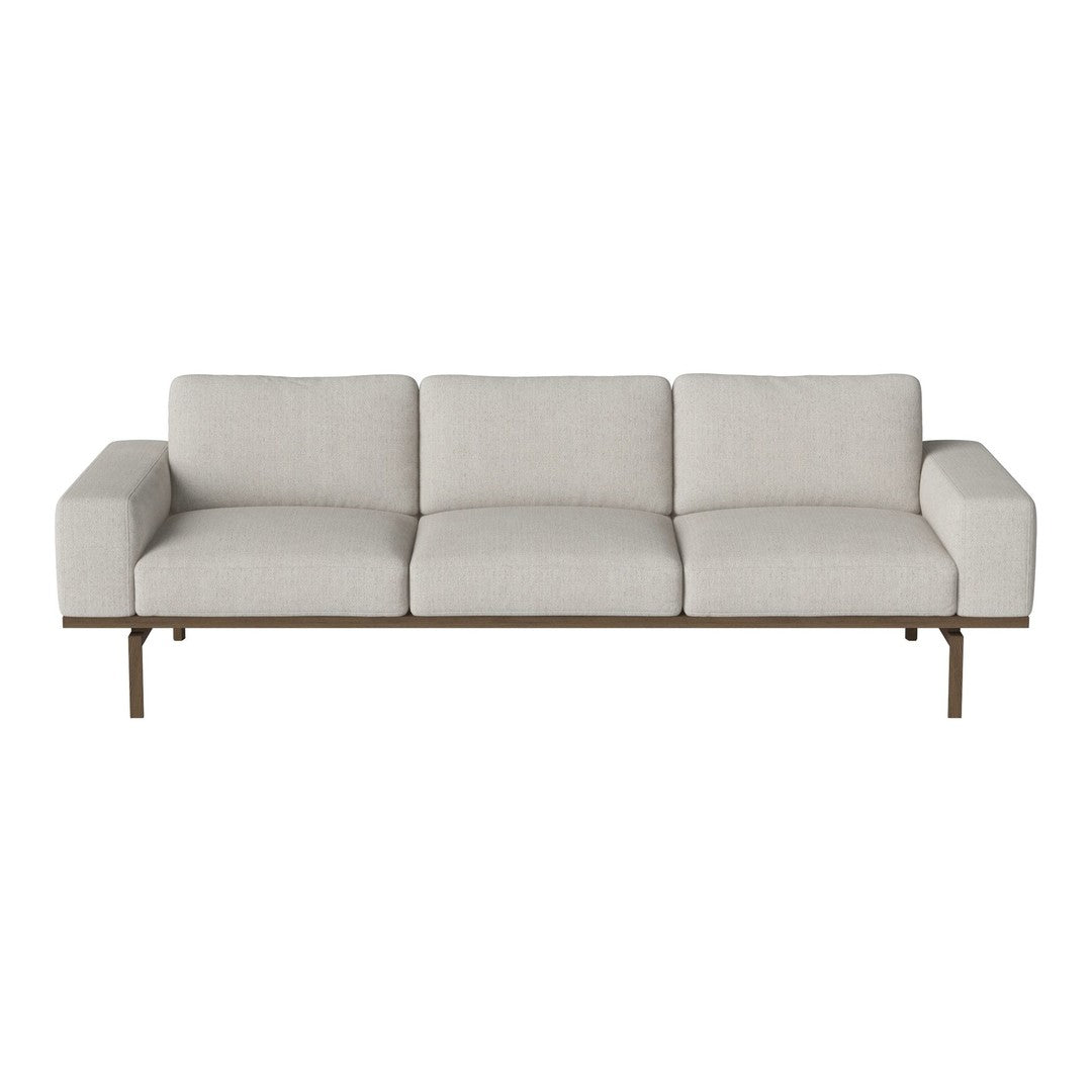 Light beige sofa with clean lines, minimalistic design, and a sleek metal frame.