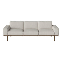 Light beige sofa with clean lines, minimalistic design, and a sleek metal frame.