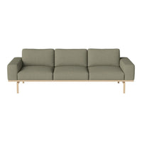 Contemporary green sofa with a textured pattern and light wooden legs, perfect for modern living spaces.