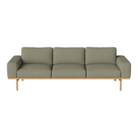 Olive green sofa with a modern design and linear pattern, complemented by a light wooden base.