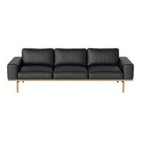 Modern black leather sofa with clean lines and a minimalist wooden frame. Ideal for contemporary living spaces.