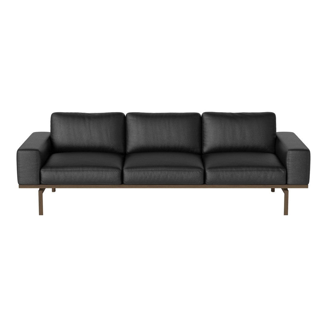 Modern black leather sofa with clean lines and a sleek metal frame, ideal for contemporary living spaces.