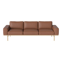 Brown leather sofa with sleek lines and a minimalistic design, featuring a light wood frame and smooth texture.