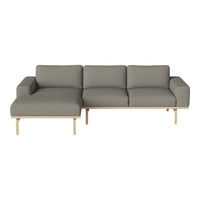 Gray upholstered sofa with clean lines and natural wooden legs, featuring a modern and minimalist design.