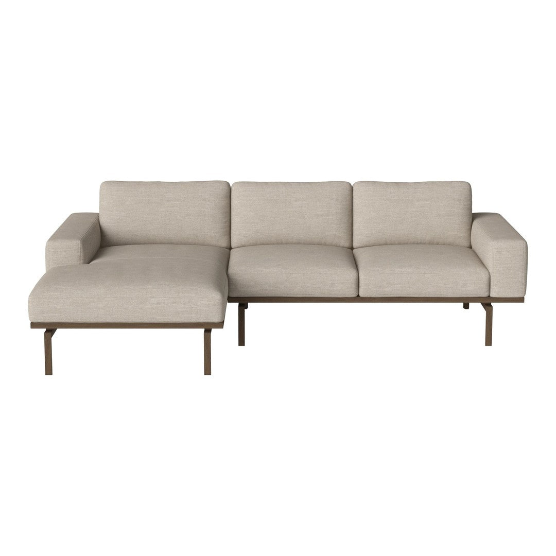 Neutral beige sectional sofa with a minimalist design and sleek brown metal legs. Perfect for modern interiors.