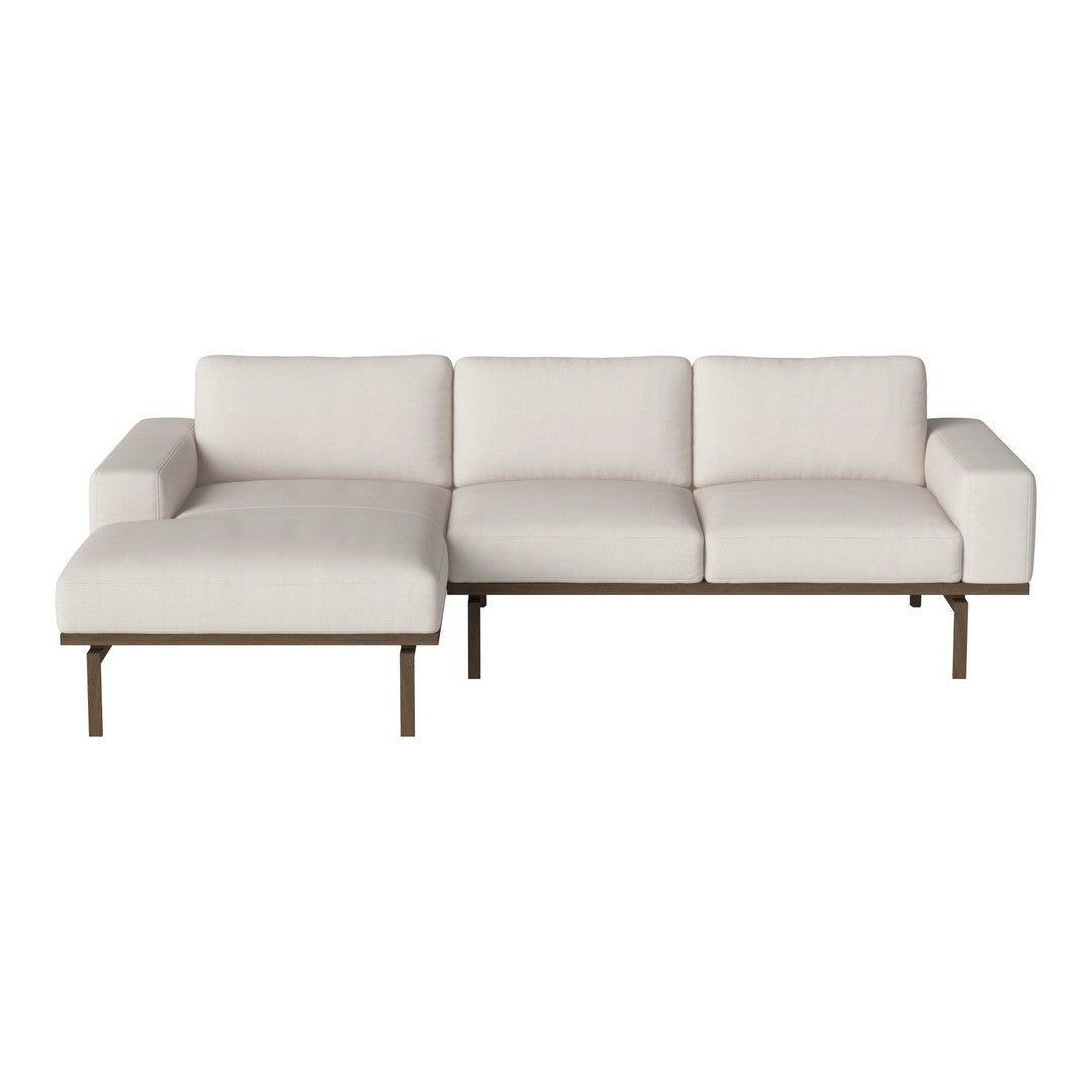 Light beige sectional sofa with a minimalist design and clean lines, featuring a soft, textured fabric.