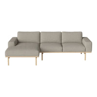 Light gray fabric sectional sofa with a modern, two-tone design and wooden legs. Perfect for contemporary interiors.