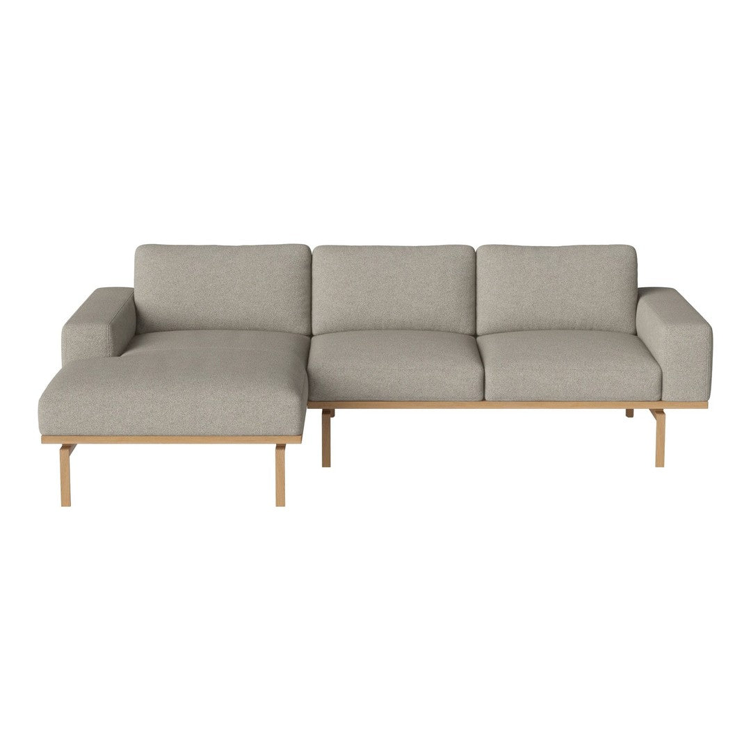 Modern gray sectional sofa with clean lines and minimalistic wooden legs, perfect for contemporary interiors.