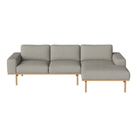 "Modern gray sectional sofa with clean lines and light wood legs, offering a minimalist style for any living space."