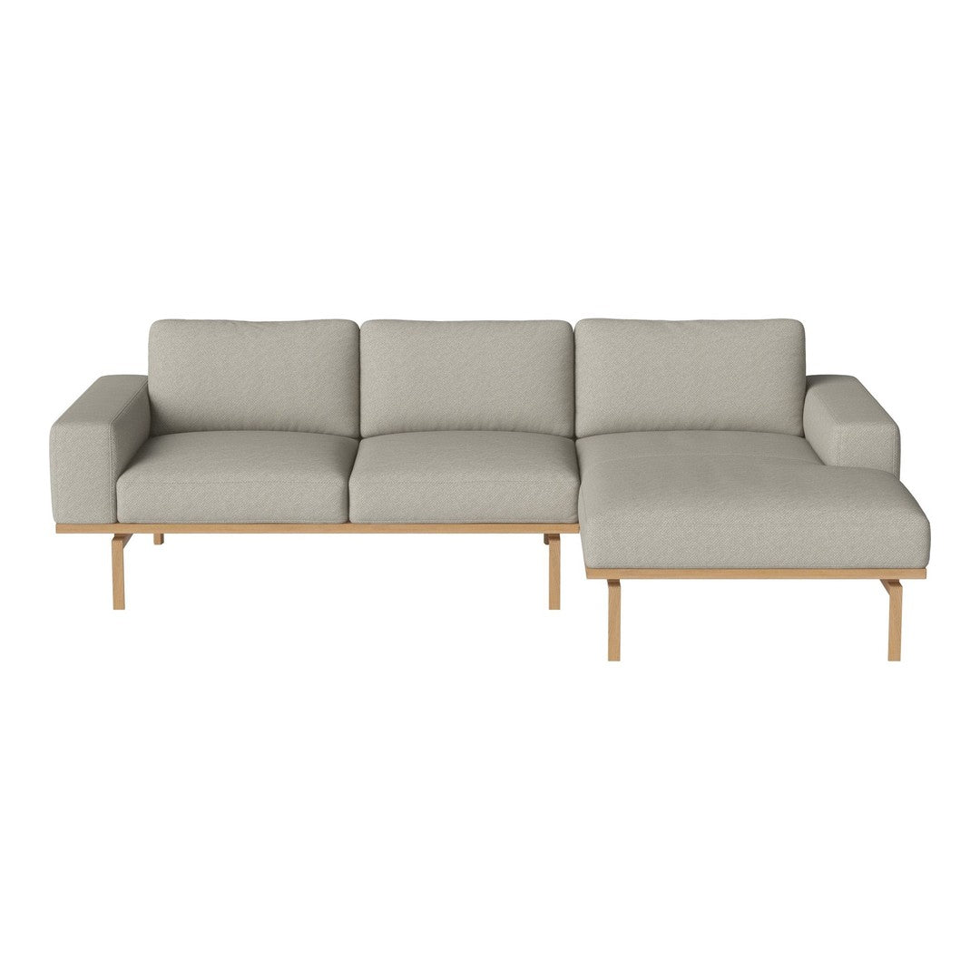 Modern gray sectional sofa with clean lines and natural wood legs, perfect for contemporary living spaces.