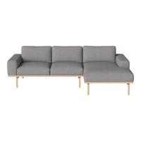 Gray modular sofa with light wood legs, featuring a minimalist design and clean lines, perfect for modern living spaces.