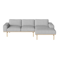 Light gray fabric sectional sofa with clean lines and natural wood legs, perfect for modern living spaces.