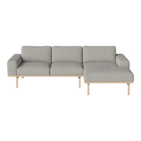 Gray fabric sectional sofa with simple, modern lines and light wooden legs. Ideal for contemporary living spaces.