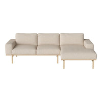 Light beige fabric sectional sofa with minimalist design and natural wood legs, showcasing a neutral and modern aesthetic.