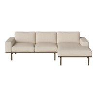 Beige fabric sectional sofa with clean lines and a minimalist design, featuring subtle texture and a modern aesthetic.