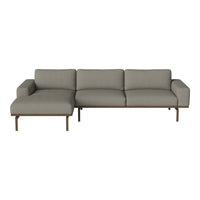 Modern gray sectional sofa with clean lines and a minimalist design, featuring a fabric upholstery and sleek metal legs.